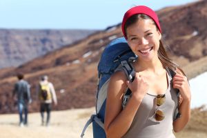 Smiling healthy young woman on hike
