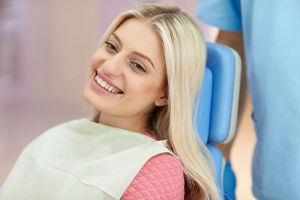 Smiling young woman at orthodontic appointment