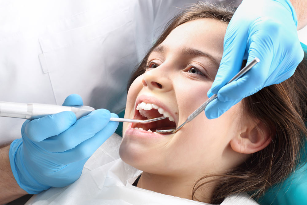 Smiling young girl at orthodontics appointment | Child Orthodontics in Appleton, WI